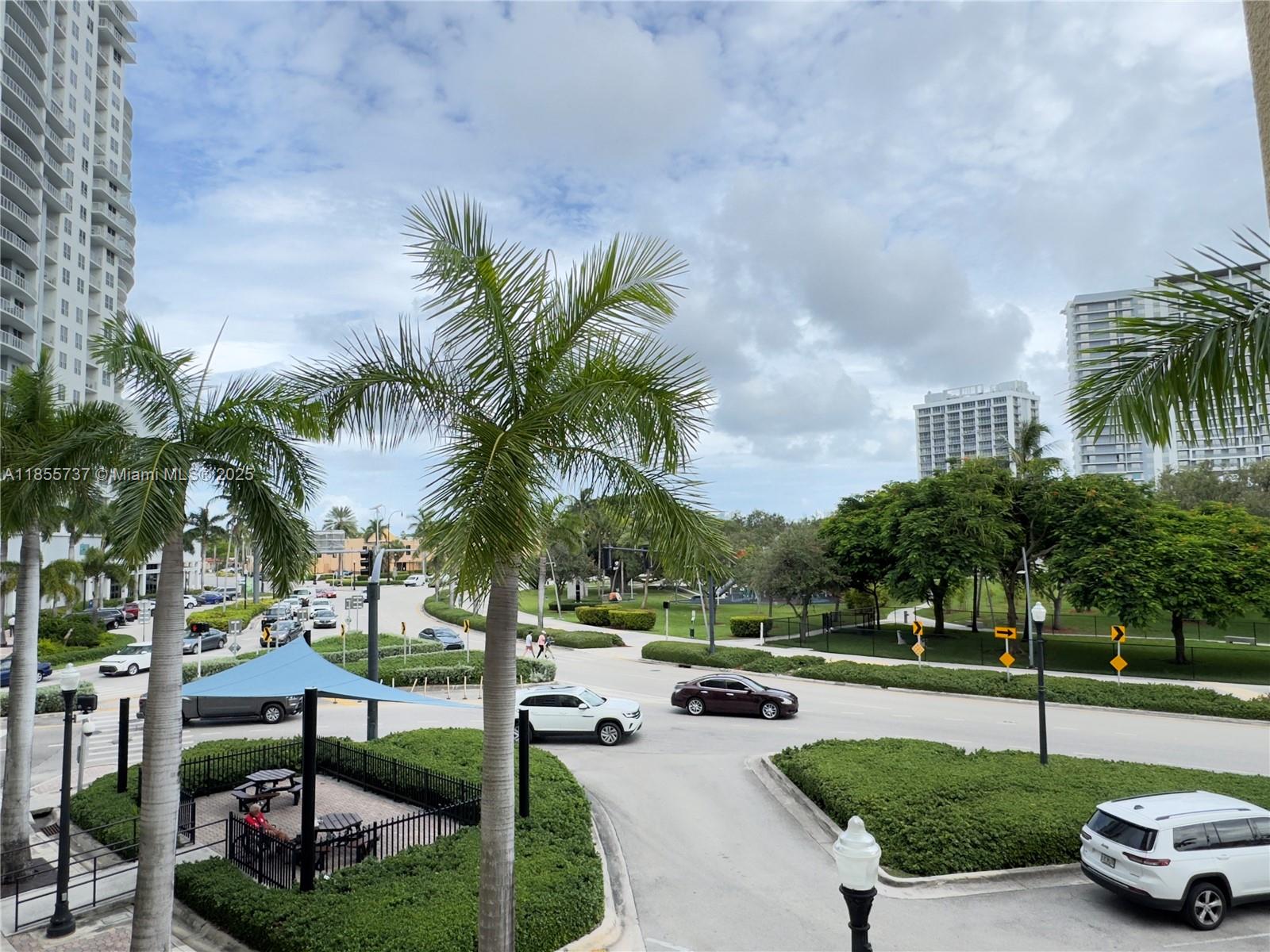 1830 Radius Drive, Unit 1301 Hollywood, FL 33020 - Photo 23 of 41 a swimming pool view with a garden
