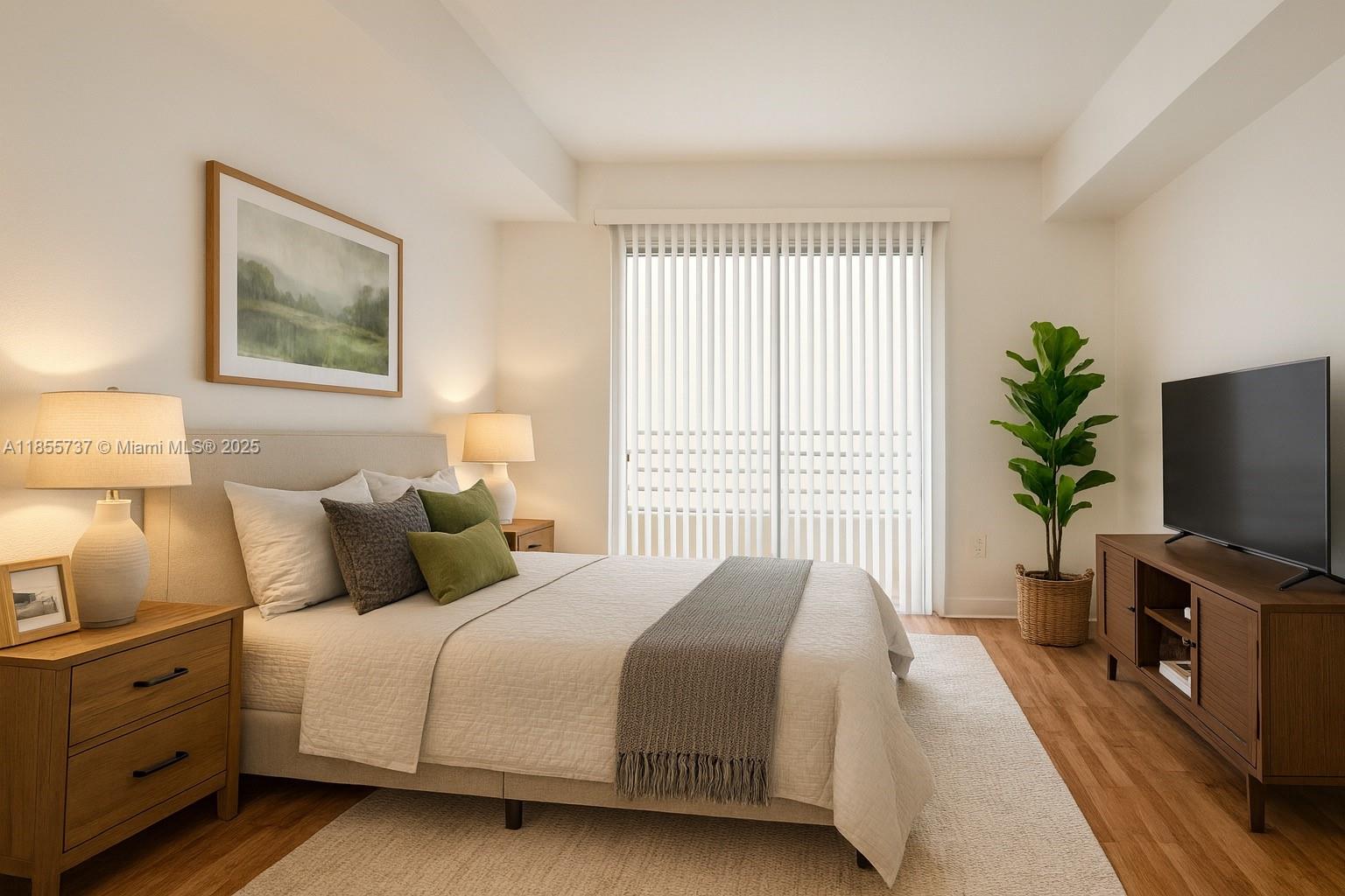 1830 Radius Drive, Unit 1301 Hollywood, FL 33020 - Photo 3 of 41 a bedroom with a bed and a flat screen tv