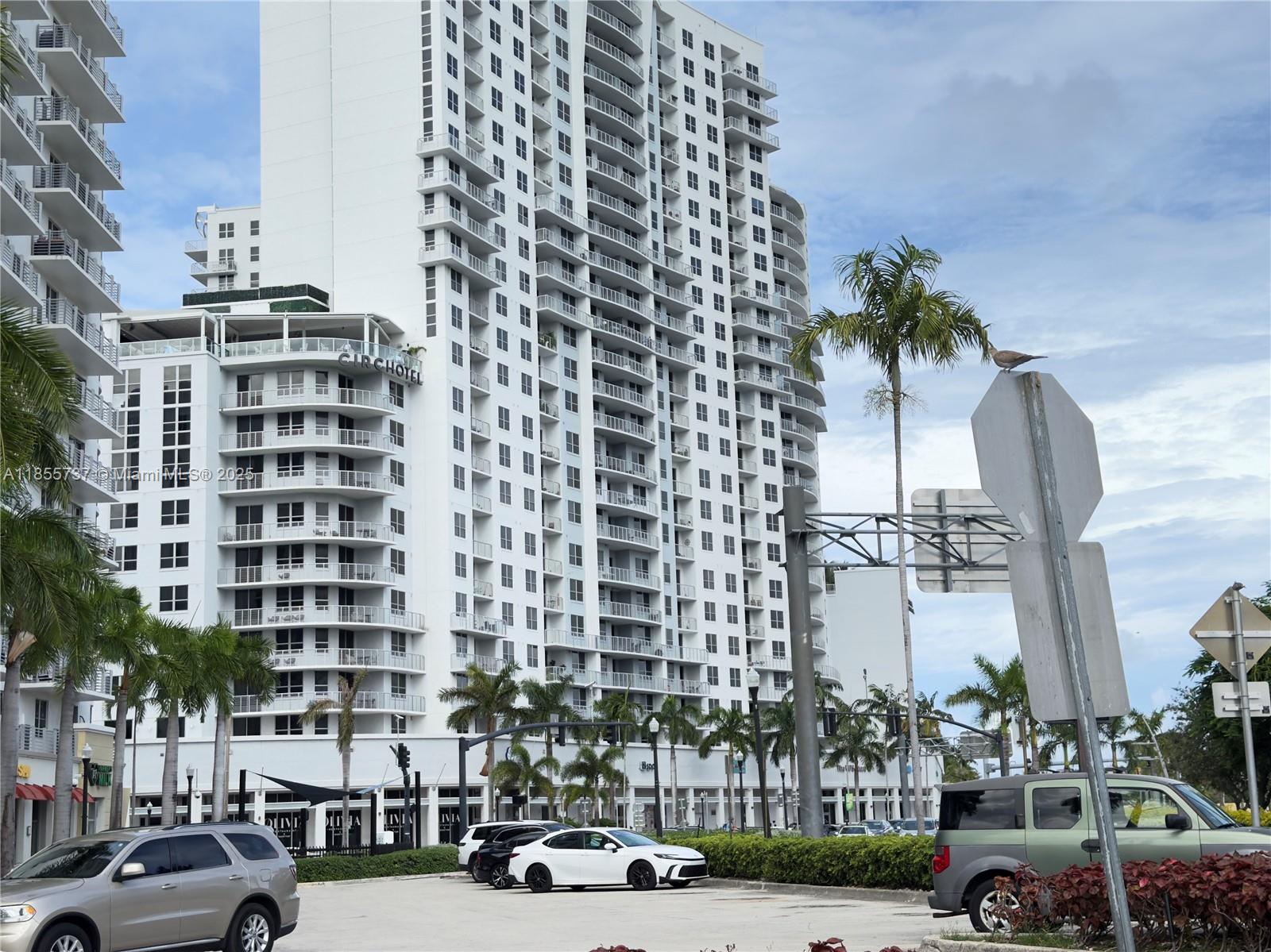 1830 Radius Drive, Unit 1301 Hollywood, FL 33020 - Photo 37 of 41 a city street lined with buildings and cars