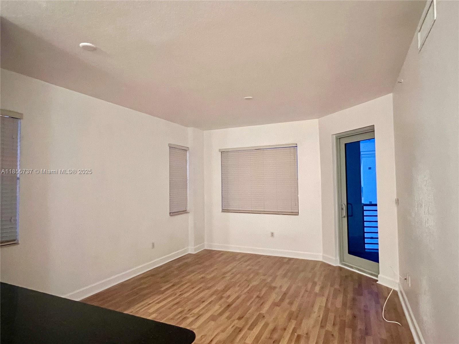 1830 Radius Drive, Unit 1301 Hollywood, FL 33020 - Photo 6 of 41 an empty room with a window