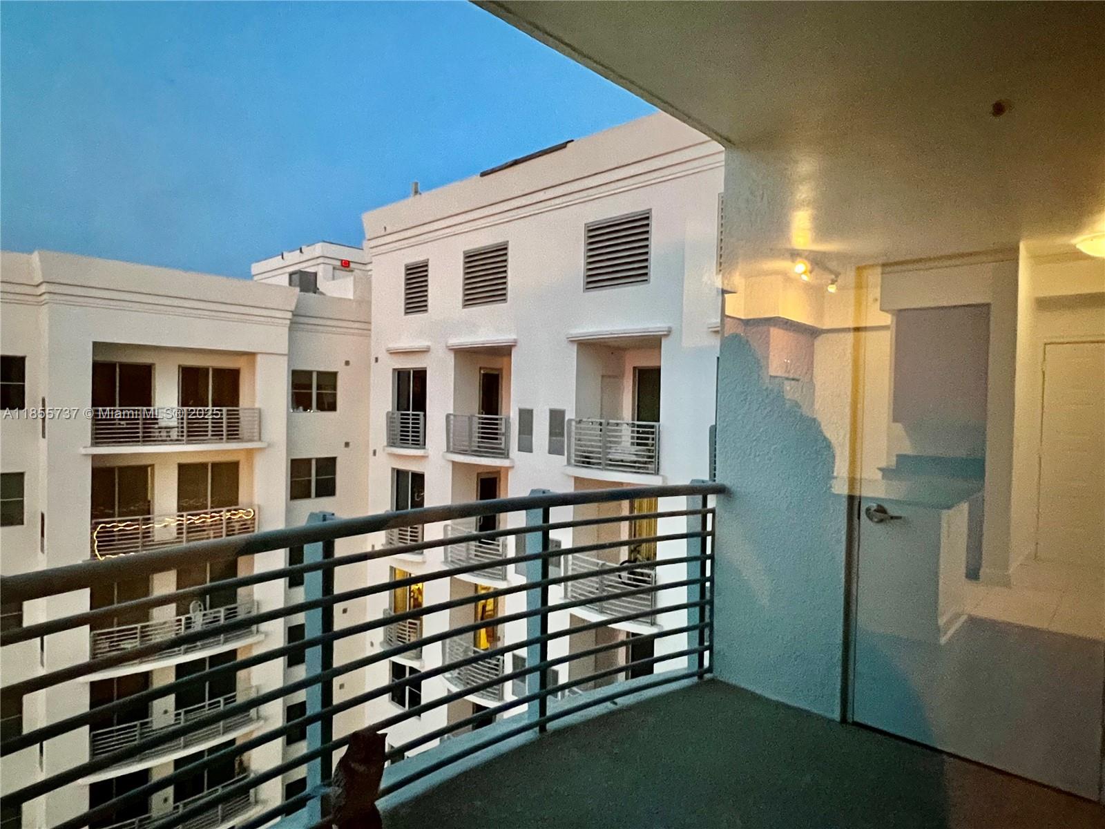 1830 Radius Drive, Unit 1301 Hollywood, FL 33020 - Photo 10 of 41 a front view of a building with glass windows