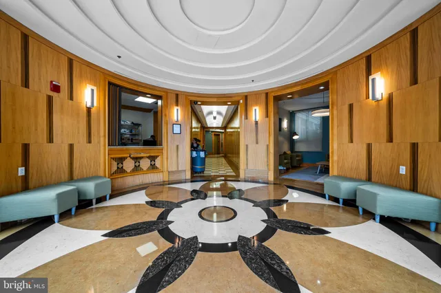 a lobby with furniture and a large window