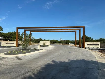a view of a car park in front of a house