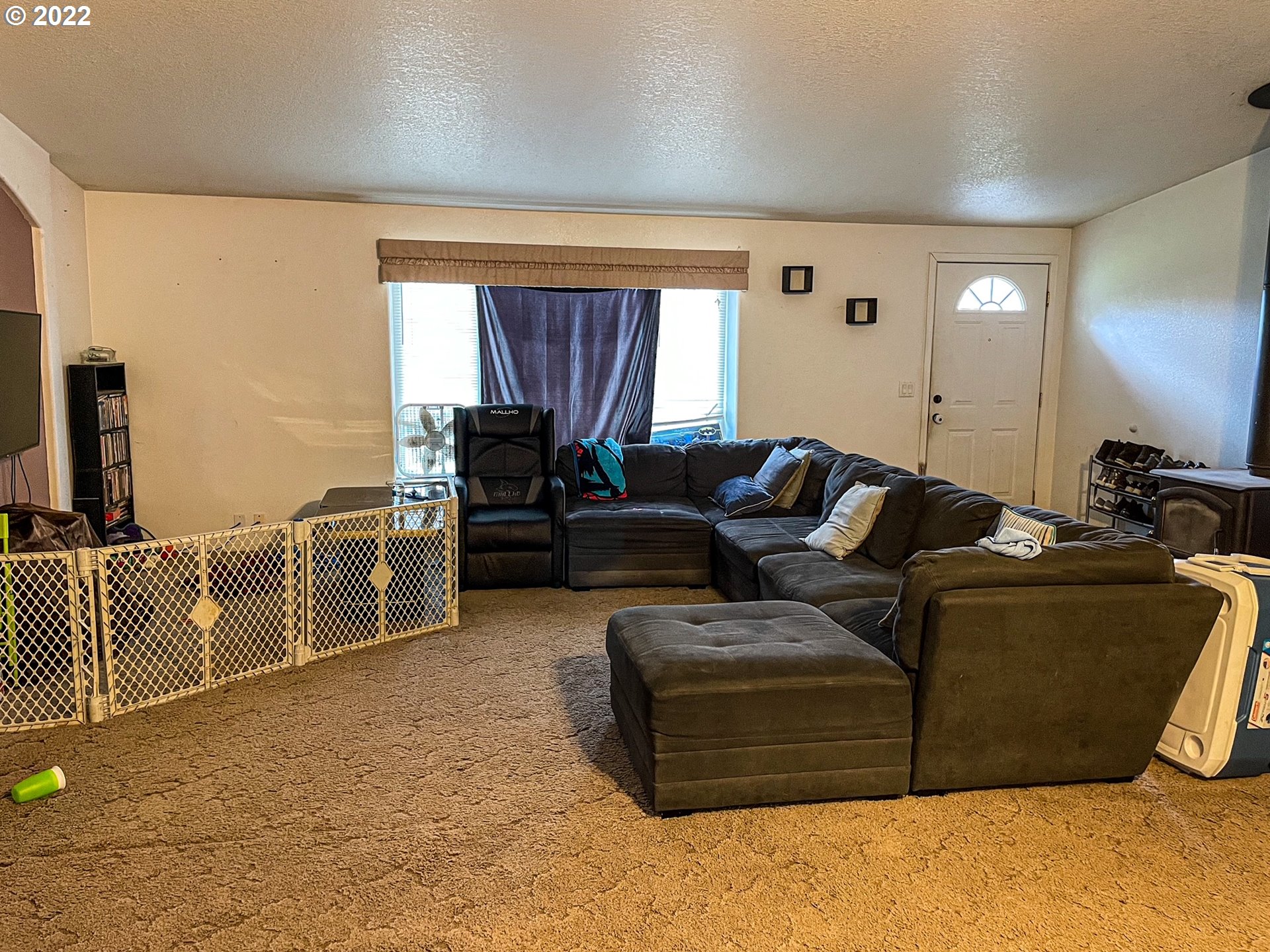 223 Neet Lane Riddle, OR 97469 - Photo 18 of 32 a living room with furniture window and a flat screen tv