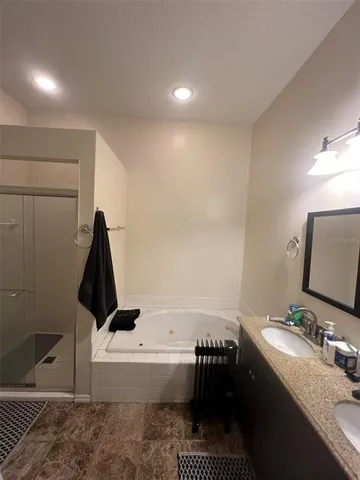 a bathroom with a bathtub sink and toilet