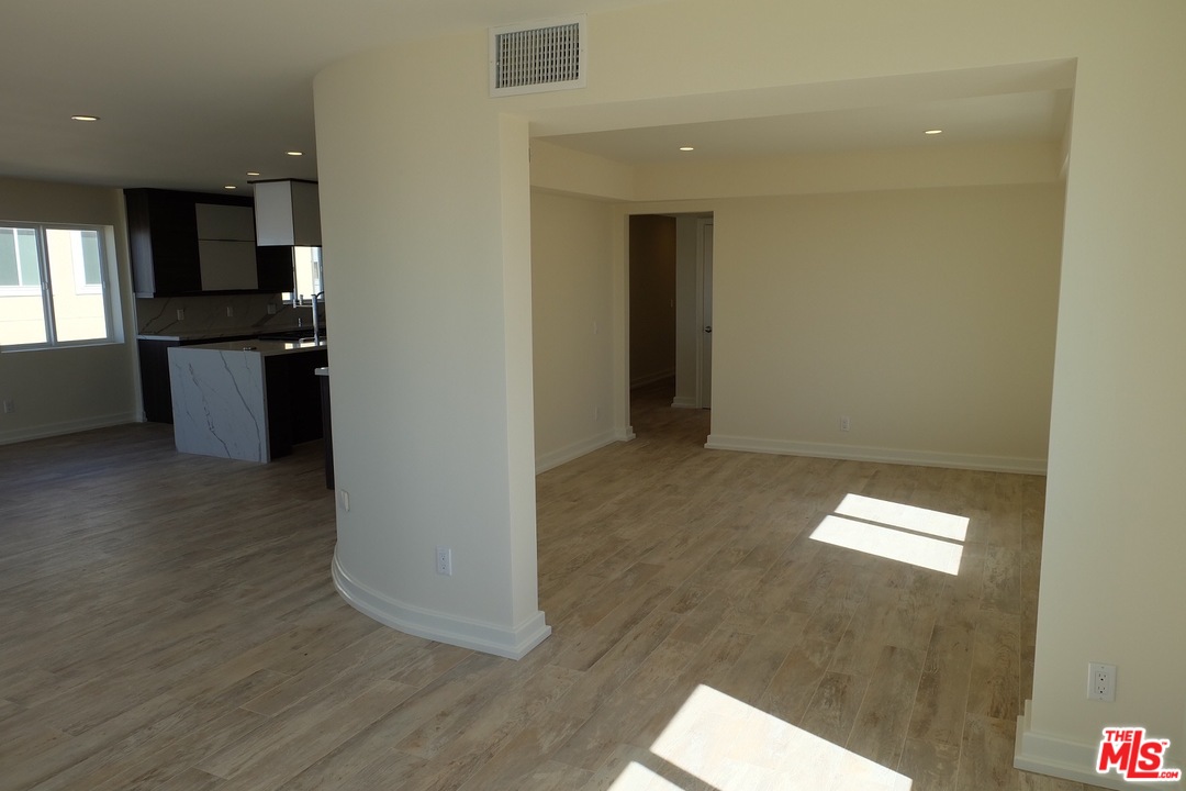 2 Catamaran Street, Unit 2 Marina del Rey, CA 90292 - Photo 11 of 17 a view of hallway with stairs and wooden floor