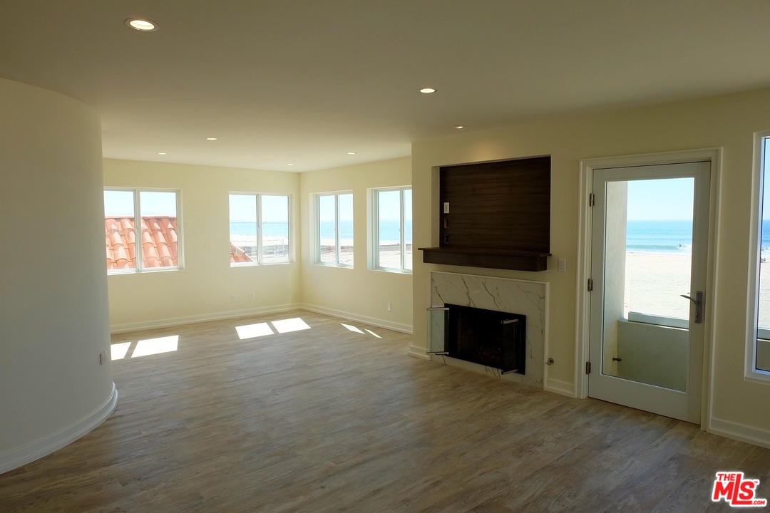 2 Catamaran Street, Unit 2 Marina del Rey, CA 90292 - Photo 2 of 17 a view of an empty room with a fireplace and a window