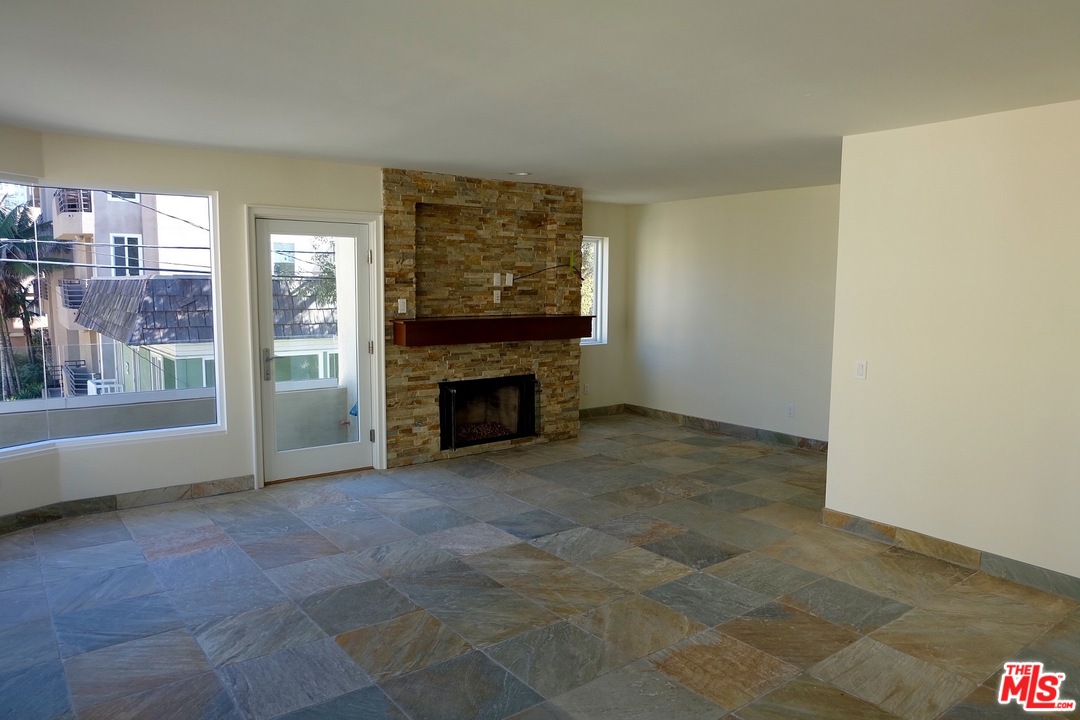 2 Catamaran Street, Unit 2 Marina del Rey, CA 90292 - Photo 5 of 17 a view of an empty room with a fireplace