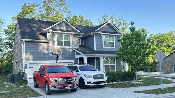 a car parked in front of a house
