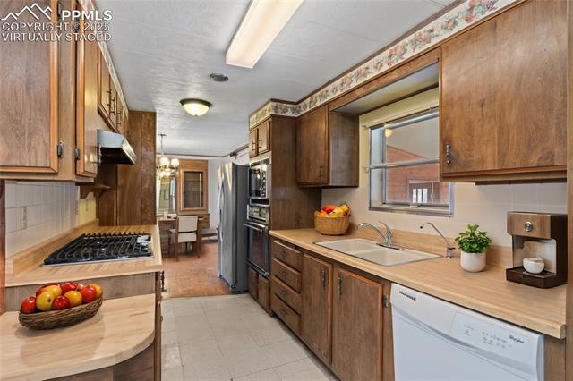 5505 Tamlin Road Colorado Springs, CO 80938 - Photo 5 of 15 “virtually staged”