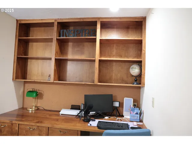 a living room with chair and a table