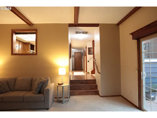 a living room with furniture and a gate