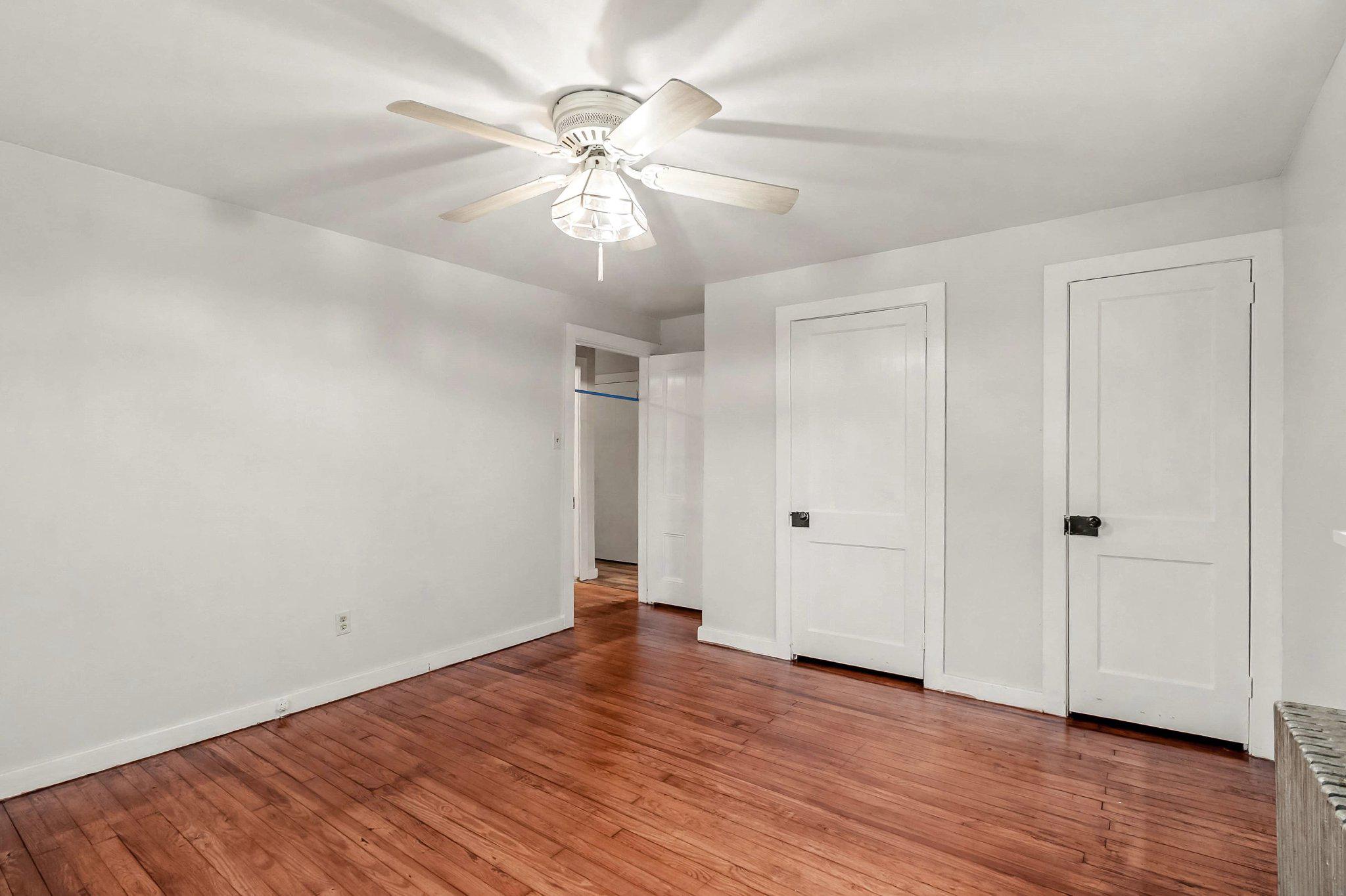 201 4th Street Boiling Springs, PA 17007 - Photo 15 of 34 a view of an empty room with wooden floor