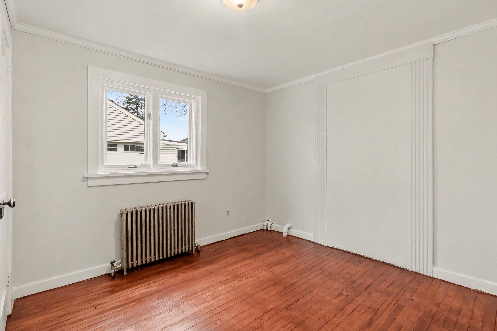 201 4th Street Boiling Springs, PA 17007 - Photo 17 of 34 an empty room with wooden floor and windows