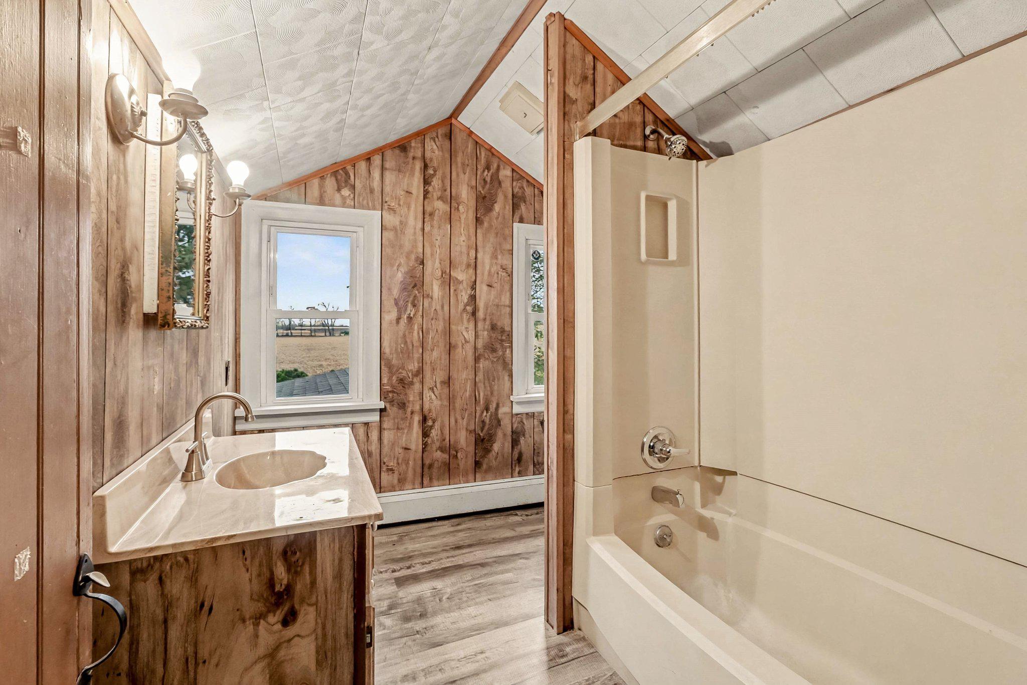 201 4th Street Boiling Springs, PA 17007 - Photo 20 of 34 a bathroom with a tub a sink and a shower