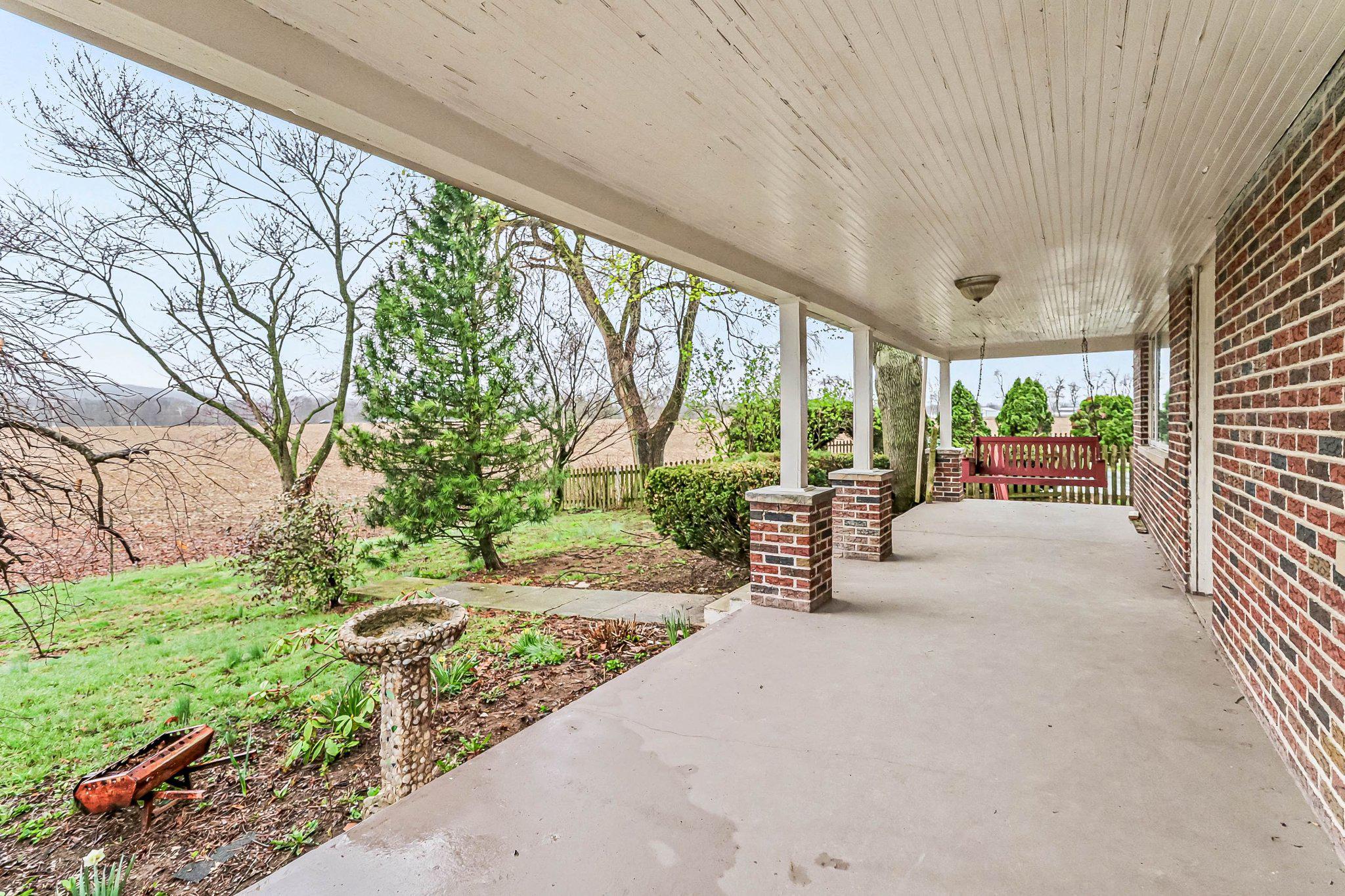 201 4th Street Boiling Springs, PA 17007 - Photo 29 of 34 a balcony with outdoor seating and trees in the background