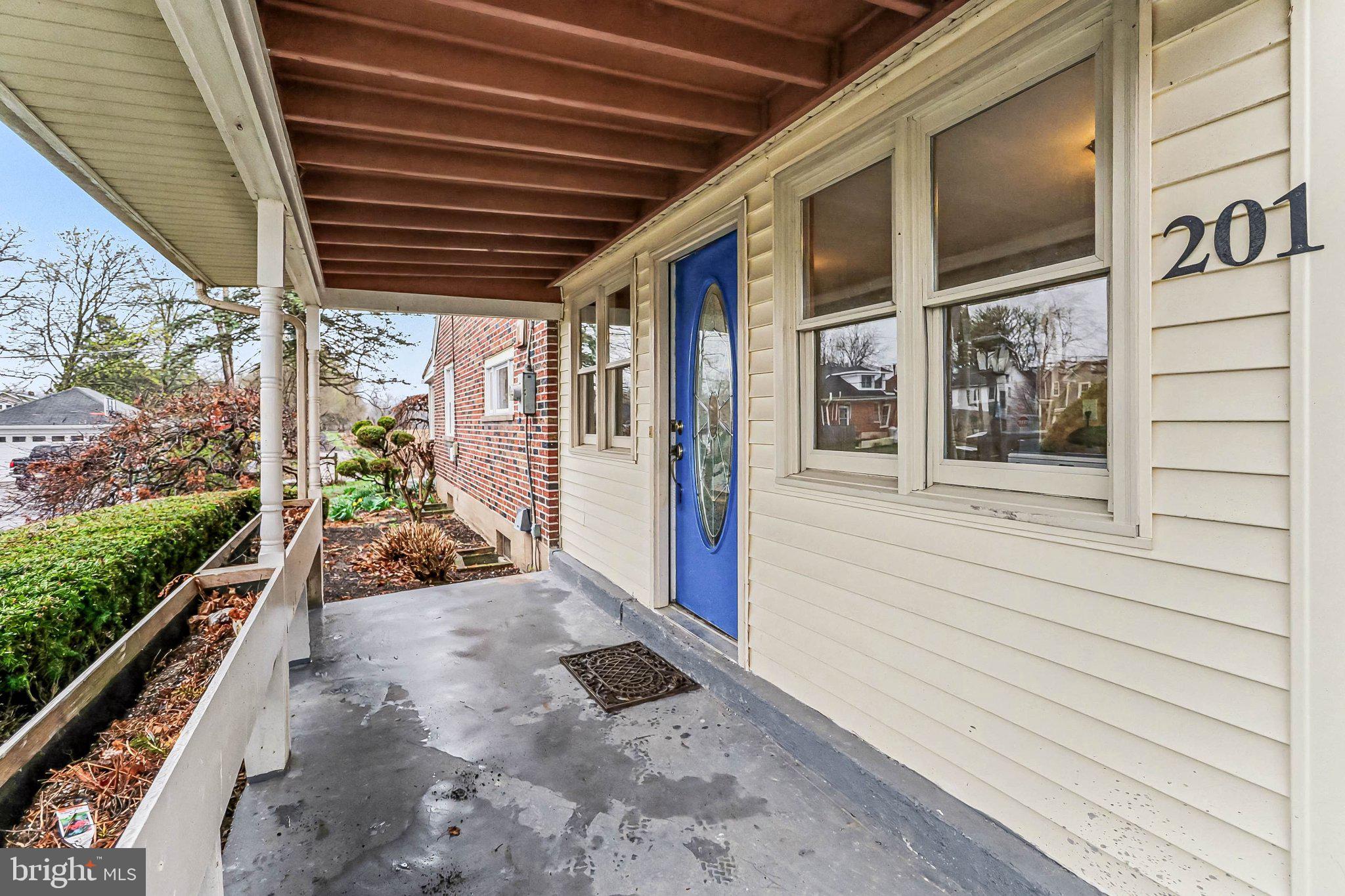 201 4th Street Boiling Springs, PA 17007 - Photo 3 of 34 a view of a porch with wooden floor and stairs