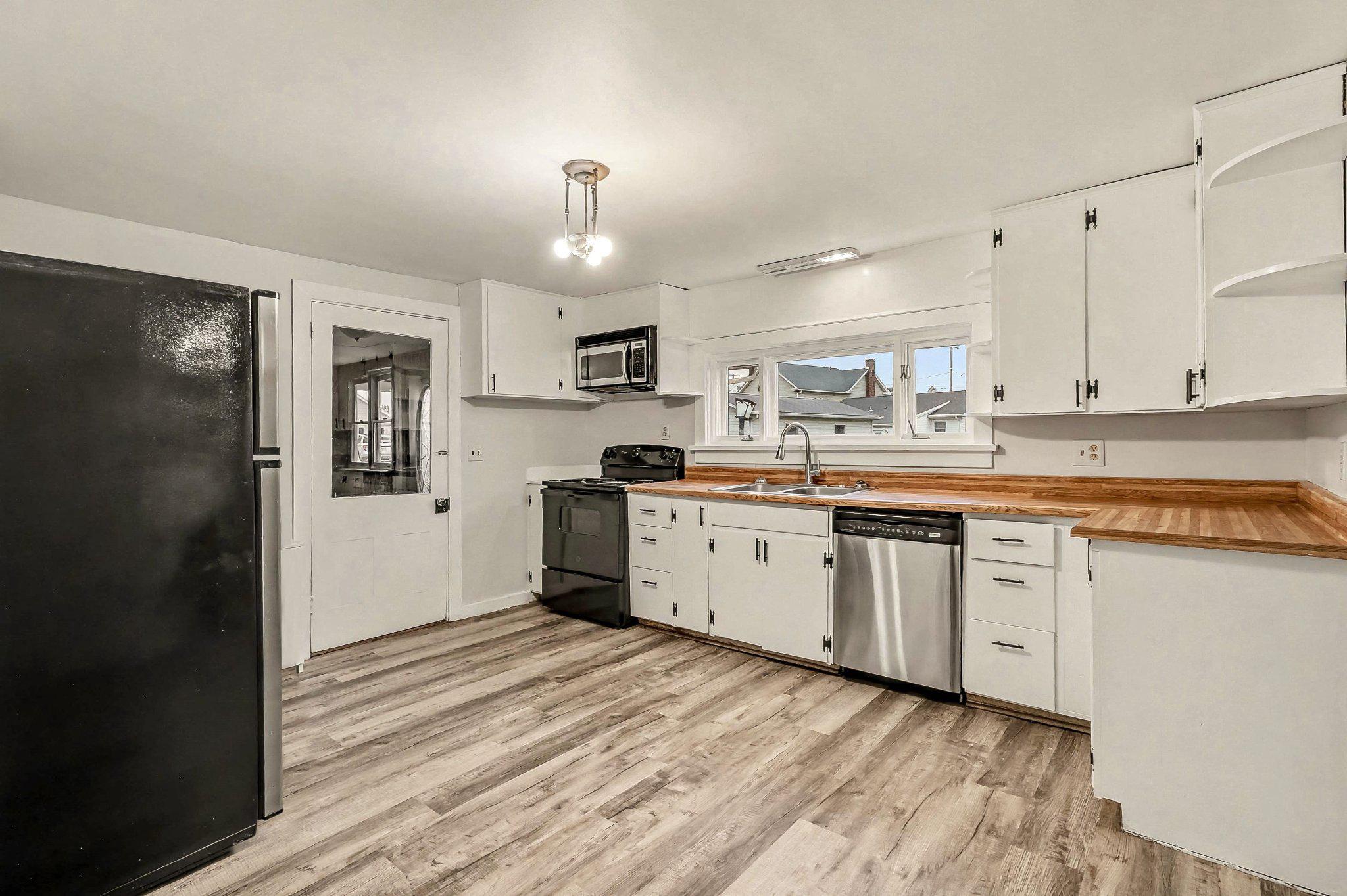 201 4th Street Boiling Springs, PA 17007 - Photo 5 of 34 a kitchen with a sink cabinets and refrigerator