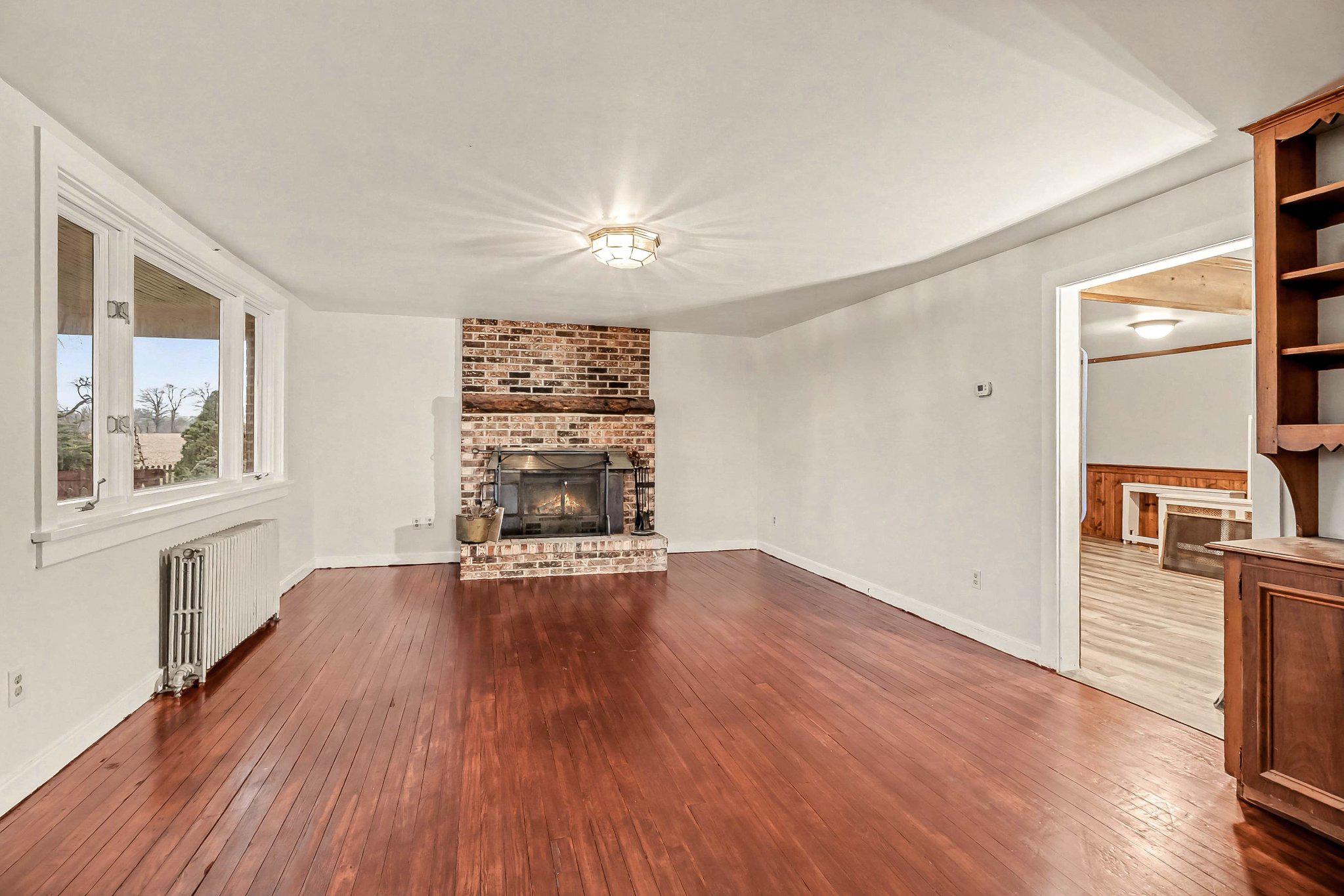 201 4th Street Boiling Springs, PA 17007 - Photo 9 of 34 wooden floor in an empty room with a window