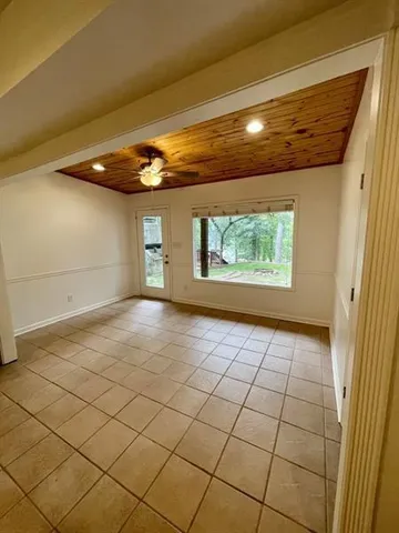 a view of an empty room and a window