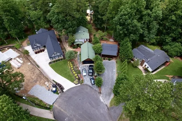 an aerial view of house with yard swimming pool and outdoor seating