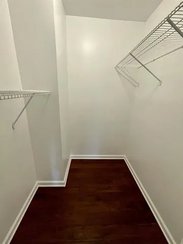 a view of a small space with racks on the wall