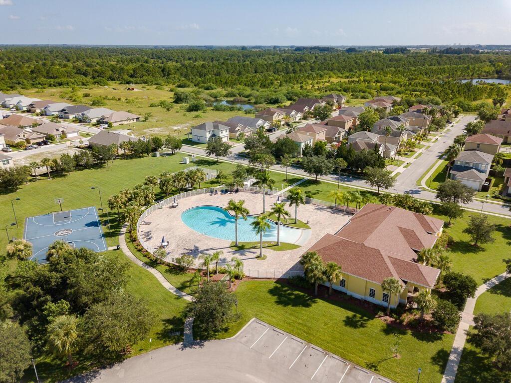 9446 Windrift Circle Fort Pierce, FL 34945 - Photo 12 of 13 an aerial view of residential houses with outdoor space and river