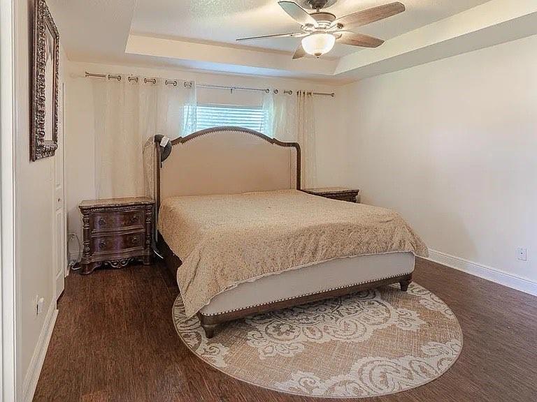 9446 Windrift Circle Fort Pierce, FL 34945 - Photo 8 of 13 a bedroom with a bed and a table