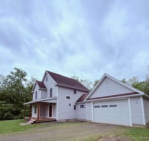 a view of house with garden