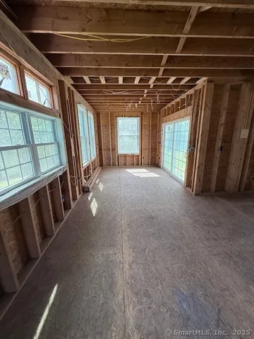 a view of a hallway with windows