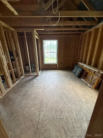 a view of an empty room with windows