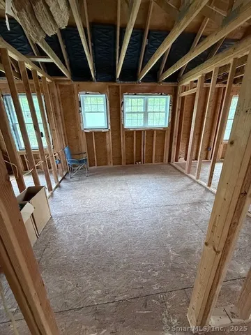 a view of empty room with windows