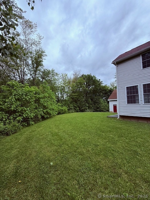 15 Suffield Street Windsor Locks, CT 06096 - Photo 6 of 32 a view of a backyard with a garden
