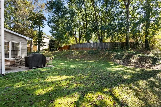 a backyard of a house with seating space