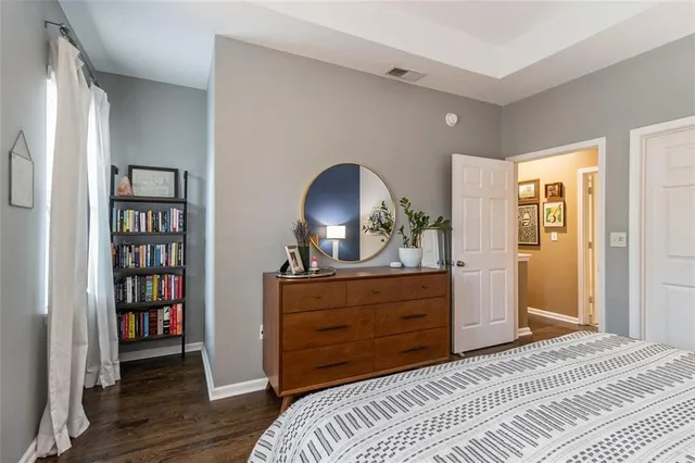 a bedroom with a bed and a dresser