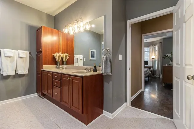a bathroom with a double vanity sink and a mirror