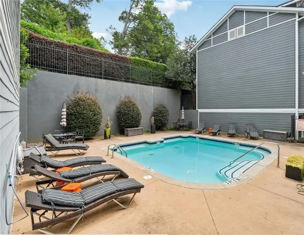 a view of a backyard with chairs