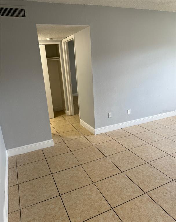 5325 Curry Ford Road, Unit G202 Orlando, FL 32812 - Photo 15 of 16 a view of a livingroom with an empty space and a window
