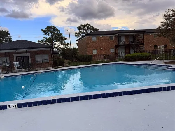 a view of a house with a swimming pool