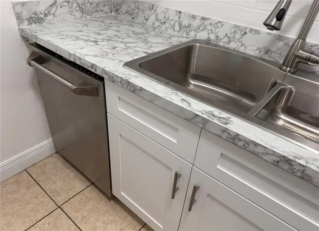 a close view of sink and washing machine