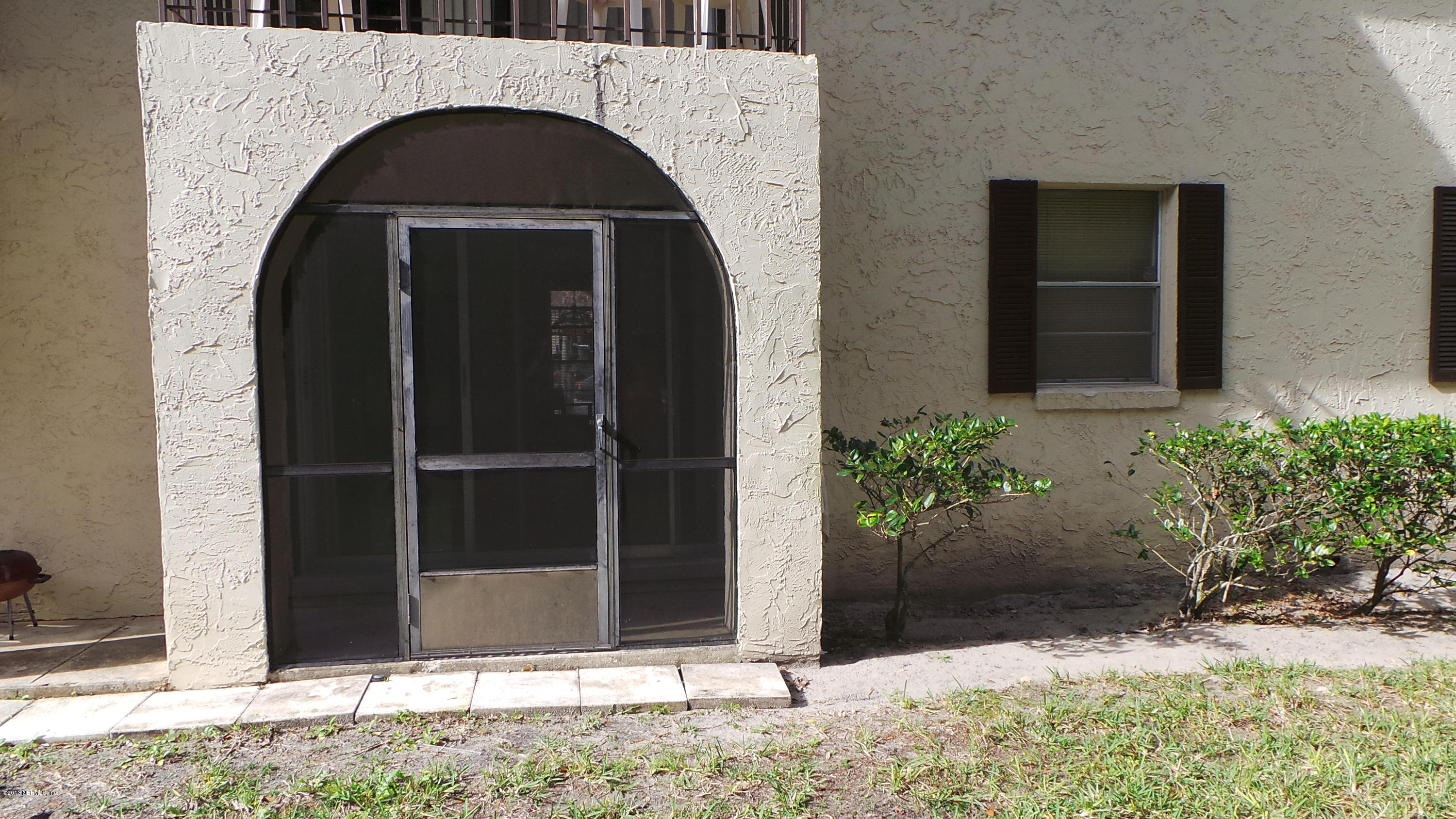 1707 El Prado Road Jacksonville, FL 32216 - Photo 14 of 18 Rear Door Screened Porch