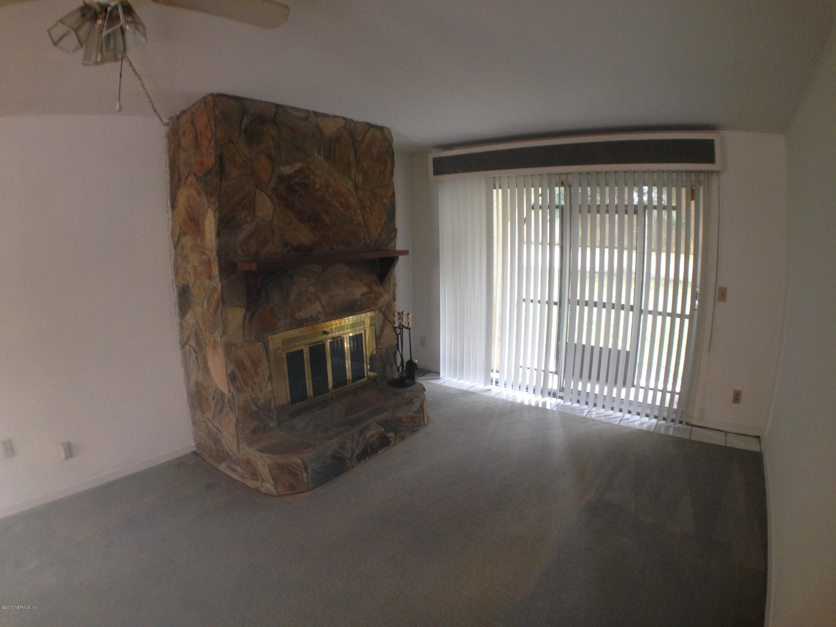 1707 El Prado Road Jacksonville, FL 32216 - Photo 2 of 18 Living room and stone fireplace