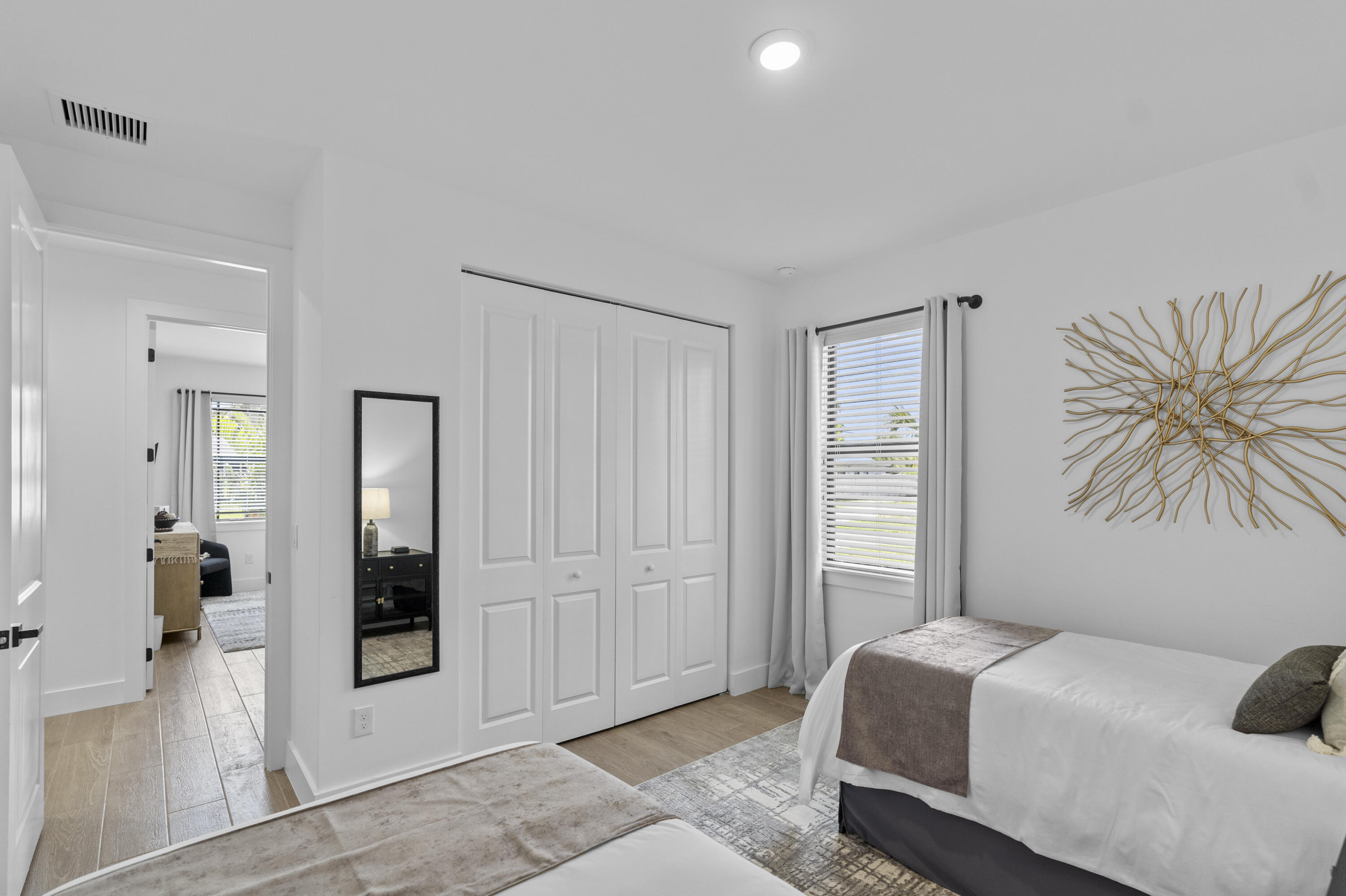 601 Southwest 3rd Street Delray Beach, FL 33444 - Photo 34 of 75 a bedroom with a bed and a chandelier