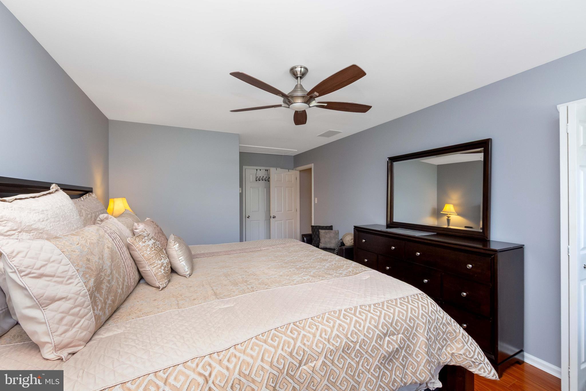 803 Tanglewood Drive Sicklerville, NJ 08081 - Photo 19 of 34 a bedroom with a bed and a chandelier