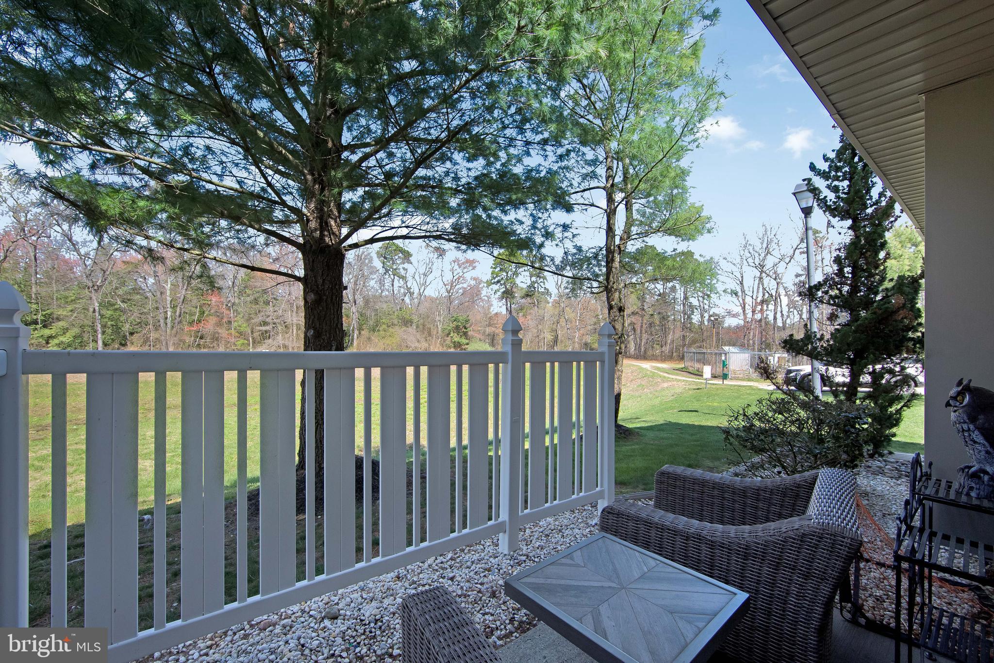 803 Tanglewood Drive Sicklerville, NJ 08081 - Photo 29 of 34 a view of a deck with a large window and wooden fence