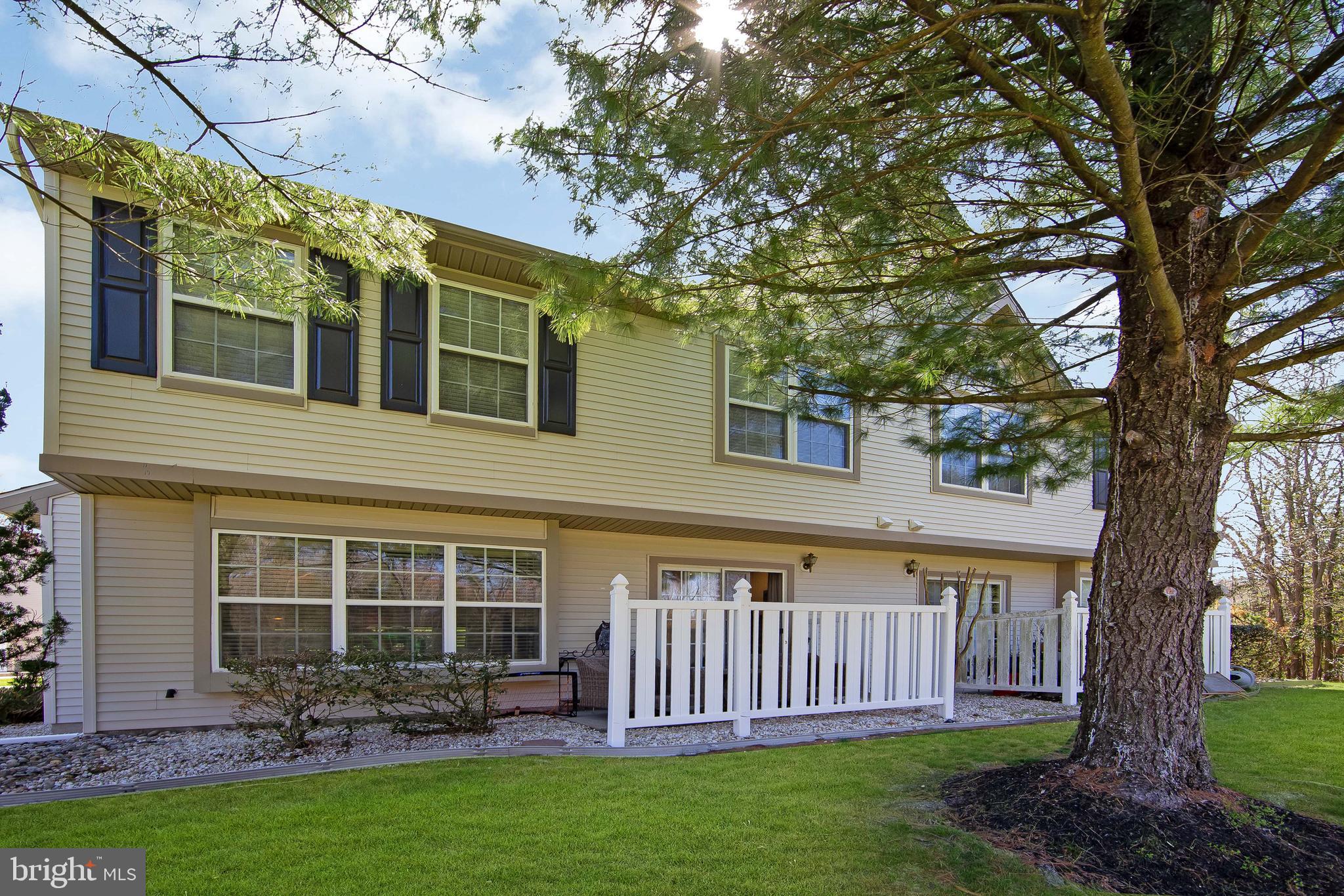 803 Tanglewood Drive Sicklerville, NJ 08081 - Photo 31 of 34 a view of a house with a yard deck and a large tree
