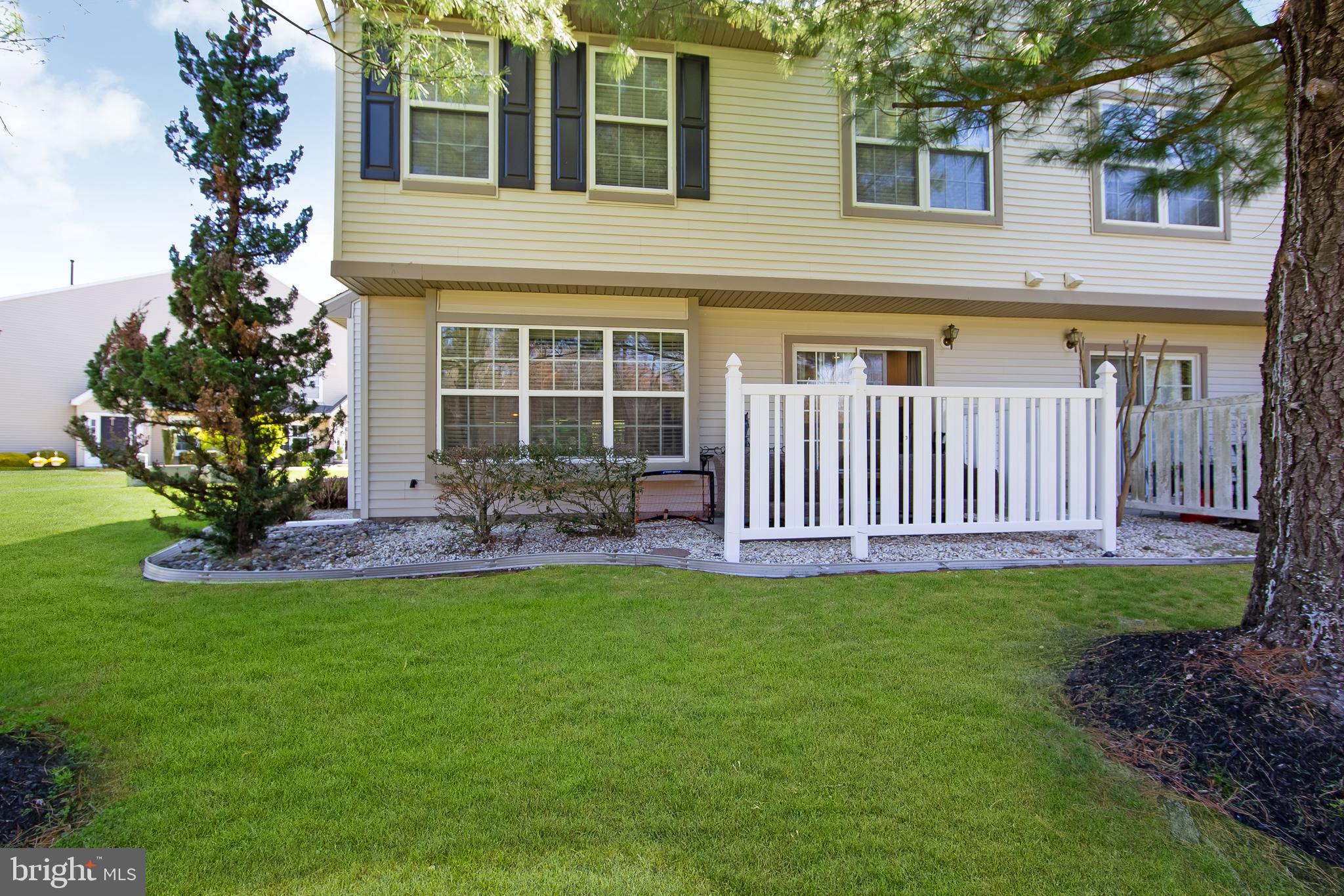 803 Tanglewood Drive Sicklerville, NJ 08081 - Photo 32 of 34 a view of a house with a yard and a garden