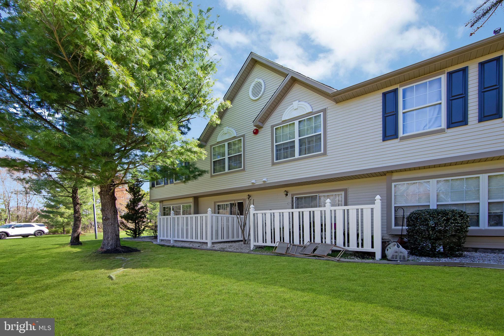 803 Tanglewood Drive Sicklerville, NJ 08081 - Photo 33 of 34 a view of a house with a yard and a garden