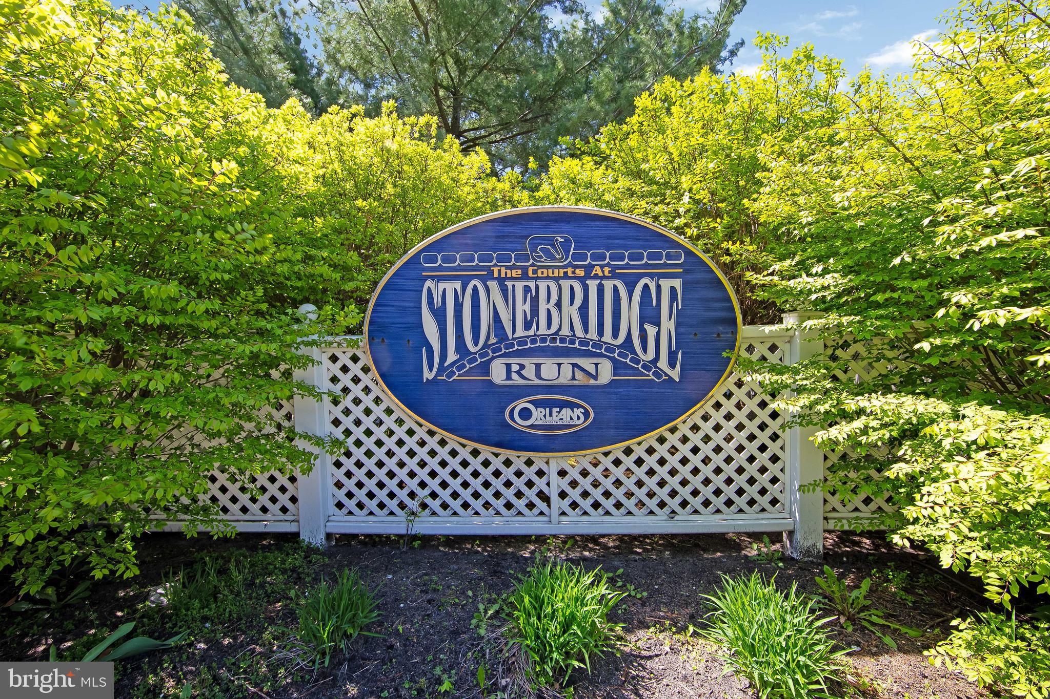 803 Tanglewood Drive Sicklerville, NJ 08081 - Photo 34 of 34 a view of a brick wall with a flower garden