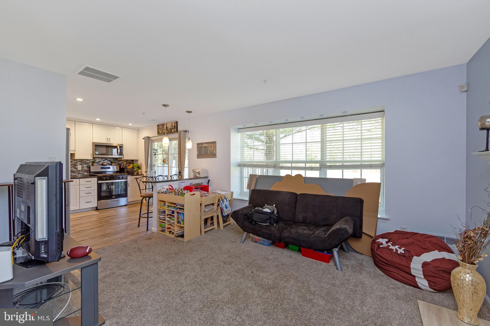 803 Tanglewood Drive Sicklerville, NJ 08081 - Photo 9 of 34 a living room with furniture and a flat screen tv